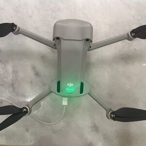 DJI Gray and Black Foldable Quadcopter Drone with Green Status Lights